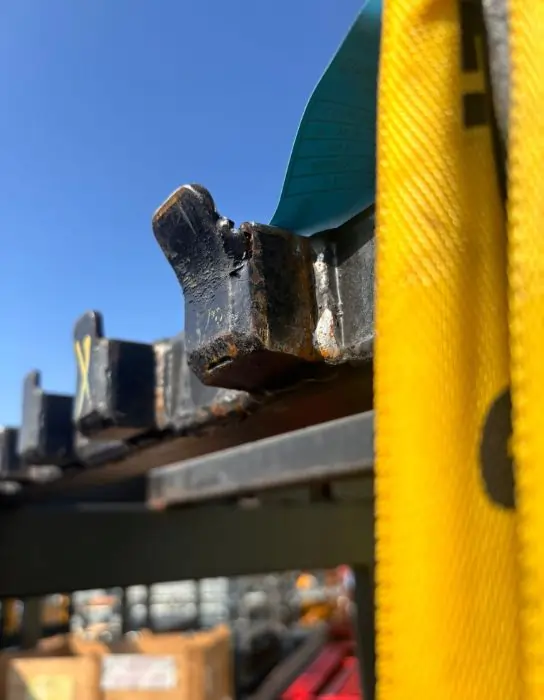 Failed weld and bent hook revealed during proof load test on lifting equipment. Industrial Lifting Ltd UK.