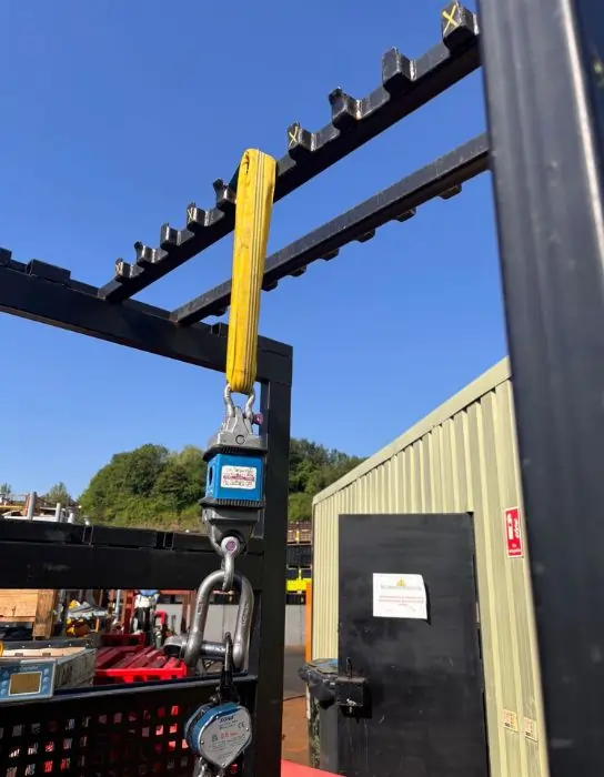 Proof load test on ram stillage using yellow sling and calibrated load cell. Industrial Lifting Ltd UK.