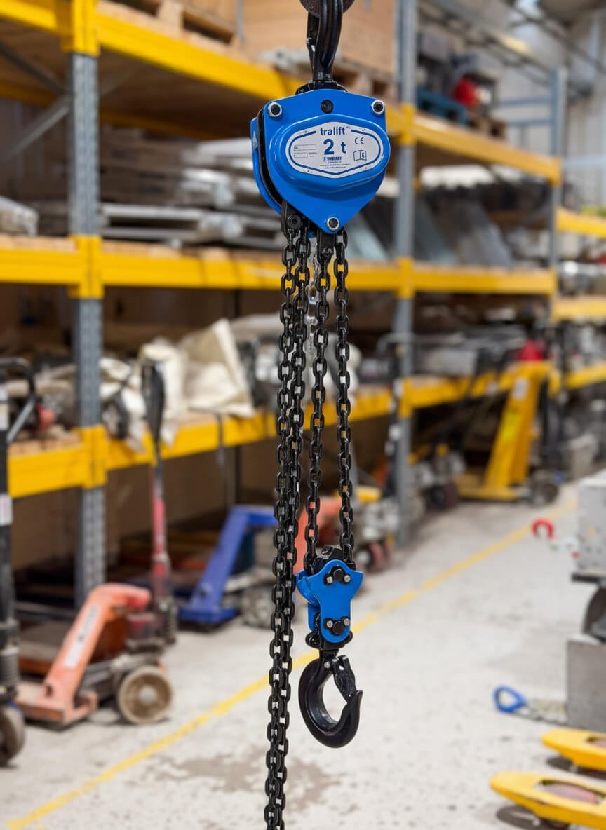 chain block hire. Blue chain block hanging in warehouse