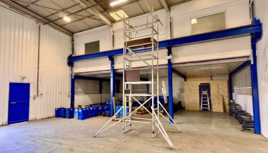 Aluminium scaffold tower in empty warehouse