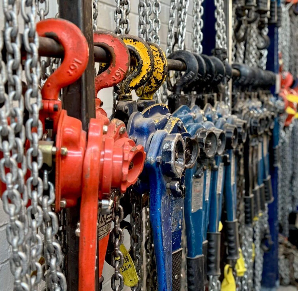 Industrial Lifting workshop racks of lever hoists and chain blocks, equipment covered by both LOLER and PUWER inspections.