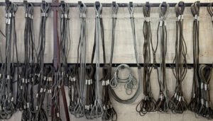 Wire rope slings hanging at Industrial Lifting, awaiting a LOLER inspection for lifting accessories.